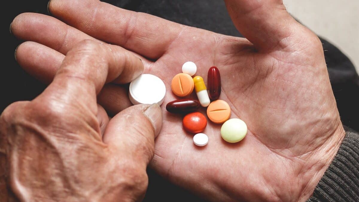 A lot of tablets in hands of the Senior